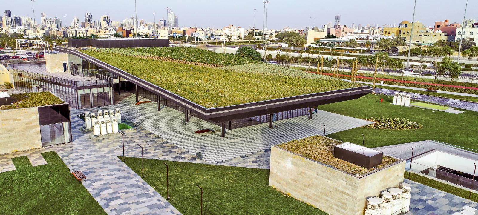 Green roofs in a park with walkways and lawn